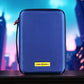 Blue Comic Shell graded comic travel case with a yellow logo on a blurred cityscape background