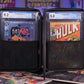 Open view of Comic Shell travel case with two graded comic books